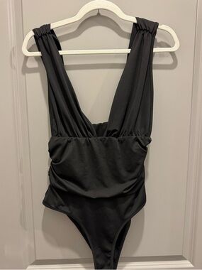 Black body suit with snaps